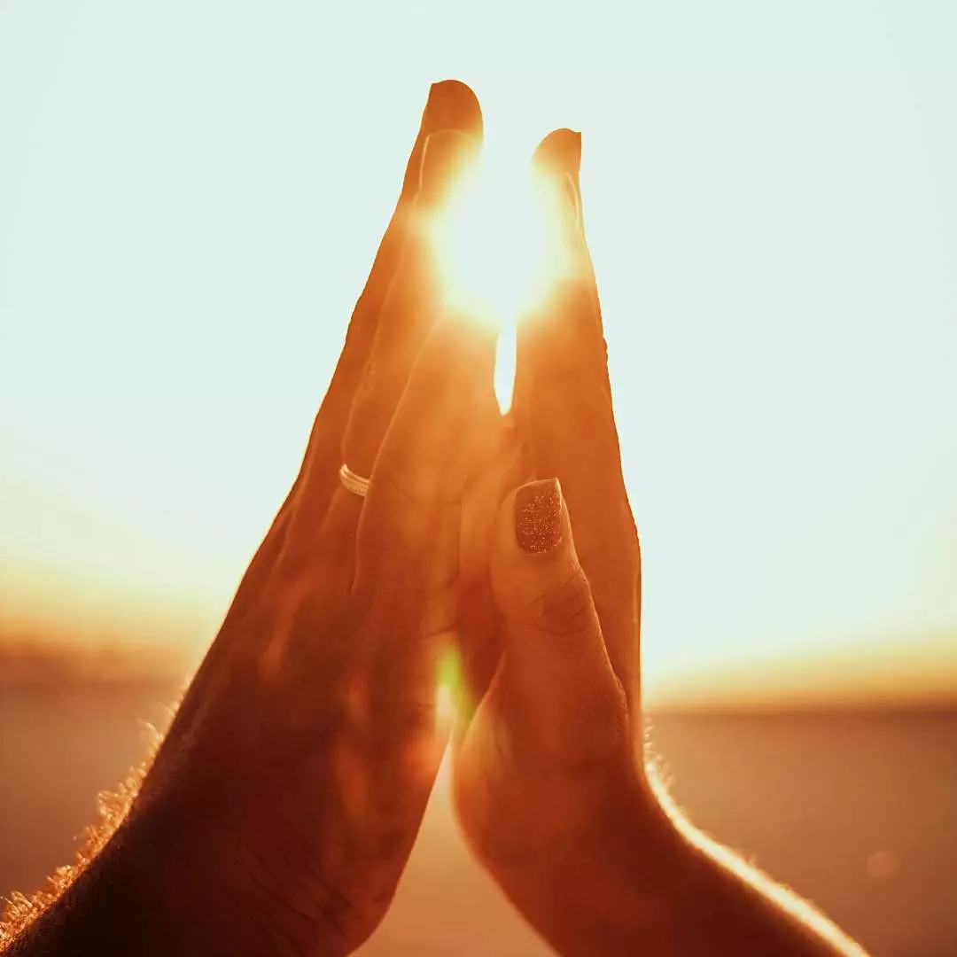 Openness and Connection Two hands reaching out to each other, symbolizing openness and connection in human relationships.